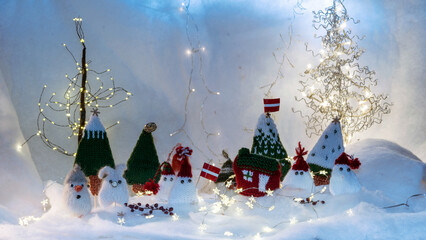 Christmas decorations from various knitted items, gnomes, snowmen, trees and houses, beautiful card, festive mood