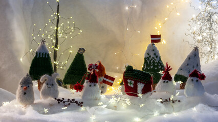 Christmas decorations from various knitted items, gnomes, snowmen, trees and houses, beautiful card, festive mood