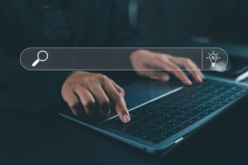 Woman typing on laptop with AI search bar interface, symbolizing artificial intelligence, data research, and innovation for smart digital solutions in modern technology and business.