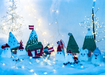 Christmas decorations from various knitted items, gnomes, snowmen, trees and houses, beautiful card, festive mood