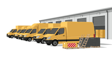 A row of yellow delivery vans are parked in front of a large warehouse building, ready for distribution.