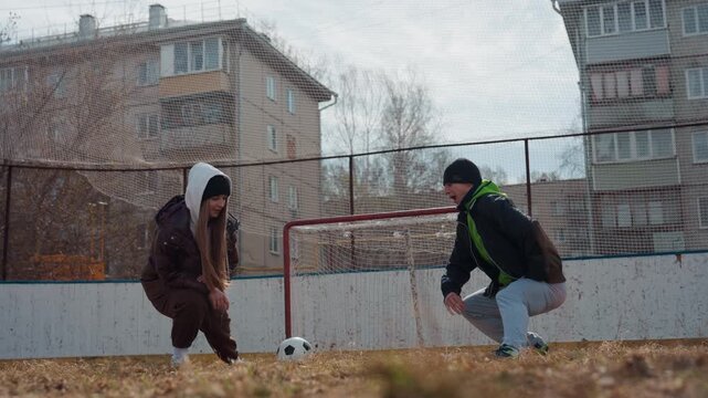 city courts await action, athlete in hoodie prepares for match, competitive game begins on urban basketball court, female competitor readies herself for intense showdown on city playground - Powered by Adobe