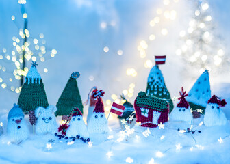 Christmas decorations from various knitted items, gnomes, snowmen, trees and houses, beautiful card, festive mood