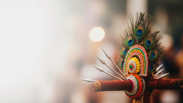 Thaipusam festival concept with peacock feathers and ritual spears on a blurred background.