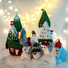 Christmas decorations from various knitted items, gnomes, snowmen, trees and houses, beautiful card, festive mood