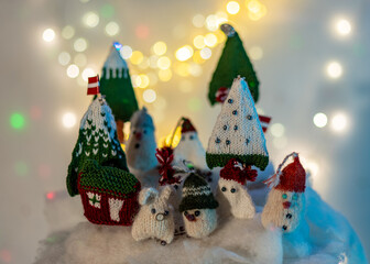 Christmas decorations from various knitted items, gnomes, snowmen, trees and houses, beautiful card, festive mood