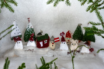Christmas decorations from various knitted items, gnomes, snowmen, trees and houses, beautiful card, festive mood