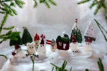 Christmas decorations from various knitted items, gnomes, snowmen, trees and houses, beautiful card, festive mood