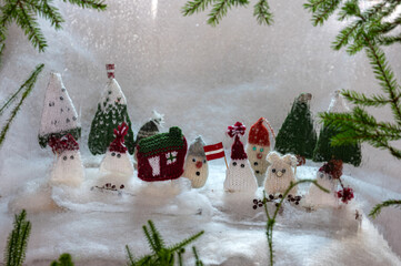 Christmas decorations from various knitted items, gnomes, snowmen, trees and houses, beautiful card, festive mood
