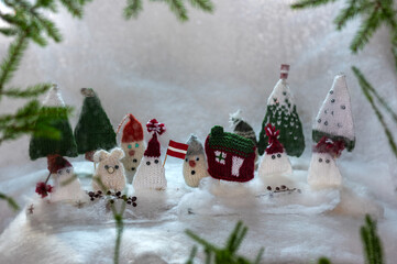 Christmas decorations from various knitted items, gnomes, snowmen, trees and houses, beautiful card, festive mood