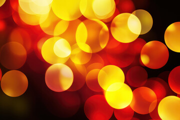 abstract bokeh lights background with blurry yellow orange red circles on dark backdrop
