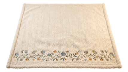 Decorative pet blanket with embroidered edges for a guest bedroom.