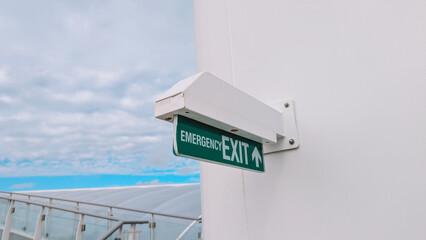 Close Up View Illuminated Green Exit Sign 