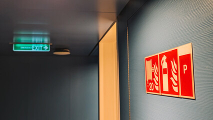 Close Up View Illuminated Green Exit Sign 
