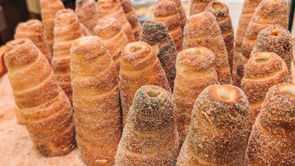 Traditional Chimney Cakes (Trdelnk) Roasting Over an Open Flame
