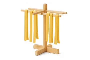 Fresh homemade fettuccine pasta drying on wooden rack