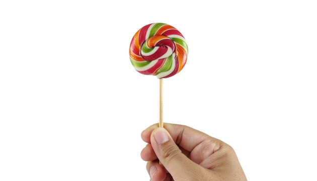 a man hand holding a sigle raibow colored lollipop