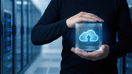Cloud upload icon in glowing glass cube held by technician showing secure data transfer emotion of trust and innovation