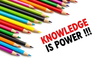 Colorful sharpened colored pencils lay near bold text emphasizing the essential message knowledge is power