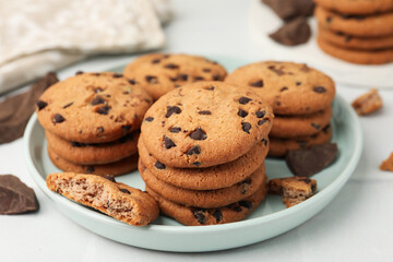 Delicious chocolate chip cookies on light table, closeup
