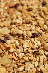 Fototapeta premium Tasty granola with dried fruits as background, closeup