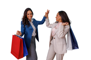 Happy women shopping giving high five, celebrating success and friendship during retail therapy with shopping bags