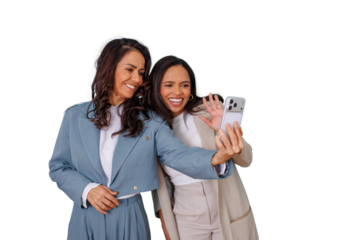 Two happy women friends taking a selfie and waving during a video call on smartphone, transparent background