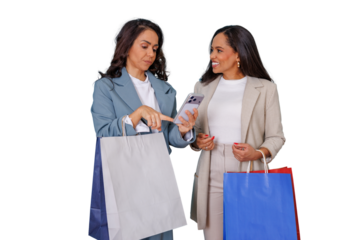 Two women shopping, pointing at smartphone screen, discussing online deals, holding bags, transparent background