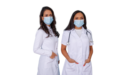 Dedicated female medical professionals wearing face masks and lab coats, standing ready to work, providing essential healthcare