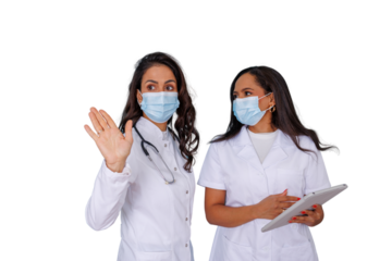 Female healthcare professionals wearing face masks and white coats, discussing patient care and health information