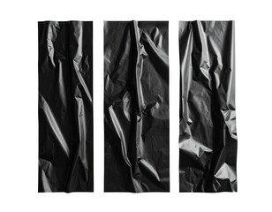 Three vertical sections of crumpled dark material, contrasting light and shadow on a dark backdrop