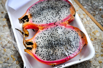 Dragon fruit slices displayed in Pattaya, Thailand, showcasing the vibrant colors and unique texture of this exotic fruit