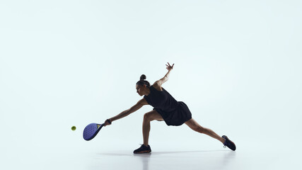 Female athlete celebrating point while holding paddle isolated on white. Concept of achievement recognition, motivation reinforcement, and success-driven business culture.