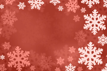 Christmas red background of pink snowflakes flying in the air. Holiday card for New Year and Christmas with space for greetings, labels and your design.