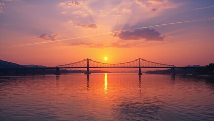 Obraz premium Dusk scene featuring the silhouette of Zhongxing Bridge piers against a sunset sky, river crossing for urban transportation, World Environment Day