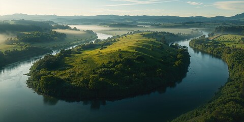 Fototapeta premium Hilly farmland with native plants near a tidal river, highlighting erosion and natural preservation