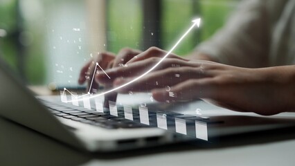 Close-up of hands typing on a laptop while a graph overlay symbolizes growth and data analysis, showcasing a modern digital workspace focused on success and innovation. Copula