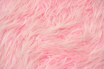 Obraz premium Soft pink fluffy texture background with plush fabric close-up for cozy and warm aesthetic.