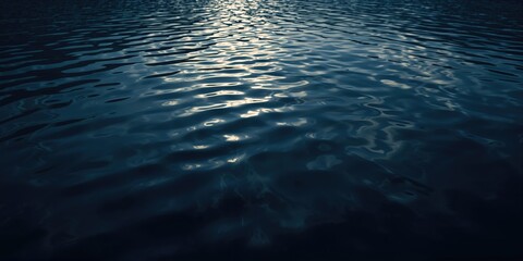 Shimmering water surface with dark ripples and light reflections, ideal for editorial header backgrounds