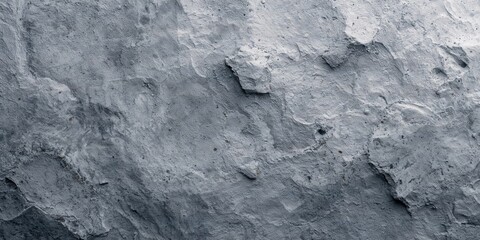 Fototapeta premium Gray textured surface serving as a background for digital interface design or editorial headers, enhancing readability