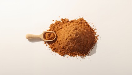 Ground cinnamon powder on neutral surface for recipe development, baking, or culinary presentation