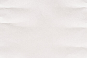 Obraz premium Crumpled white paper texture for background use in design and creativity projects.
