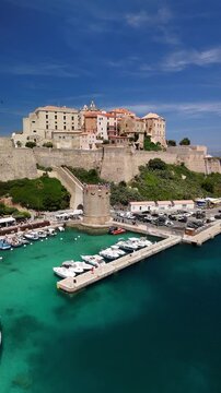 Aerial Drone Pan of Calvi Citadel and Scenic Marina Harbor in Corsica France
