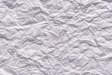 Crumpled white paper texture close-up for creative design and background concepts.