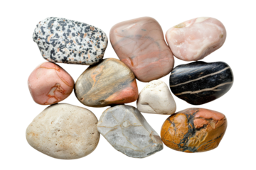 Natural stones are arranged in a cluster from a top view. Each stone displays different colors and patterns. This composition is set on a transparent background for clear visual focus