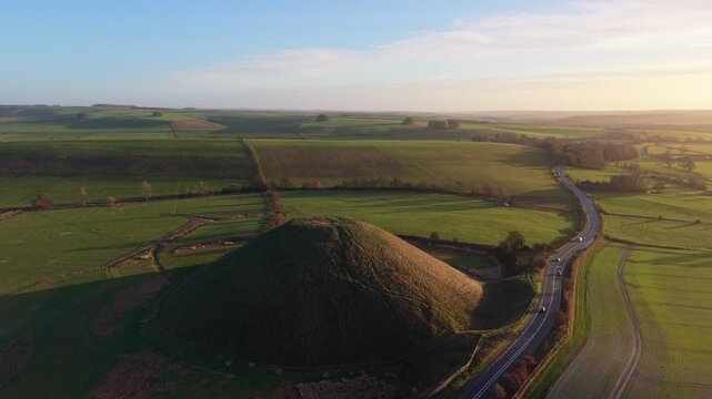 Aerial View of Silbury Hill Prehistoric Monument in Wiltshire on a Sunny Morning