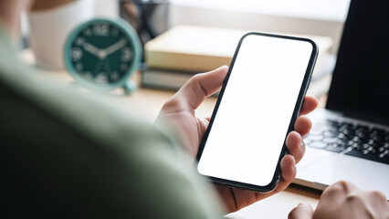 A woman's hand holding a credit card over a digital smartphone screen for a wireless business transaction using mobile internet technology on a smart communication device