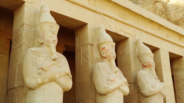 Statues of Osiris. Hatshepsut Funeral Temple in Luxor. A historical landmark of ancient Egypt during the time of the pharaohs.