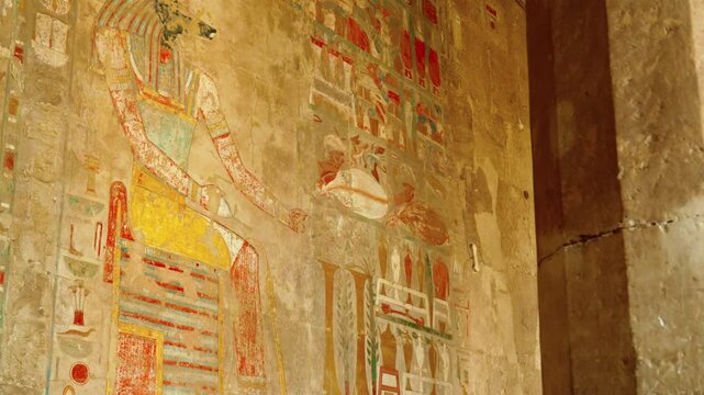 Colored hieroglyphs on the walls of the sacrificial room of the Hatshepsut funeral temple in Luxor. The temple of Ancient Egypt.