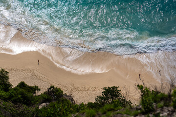 Aerial Top-Down View of a Beach with Gentle White Foamy Waves High quality photo